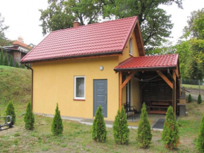 Cottage with fireplace, right on the lake, Ryn